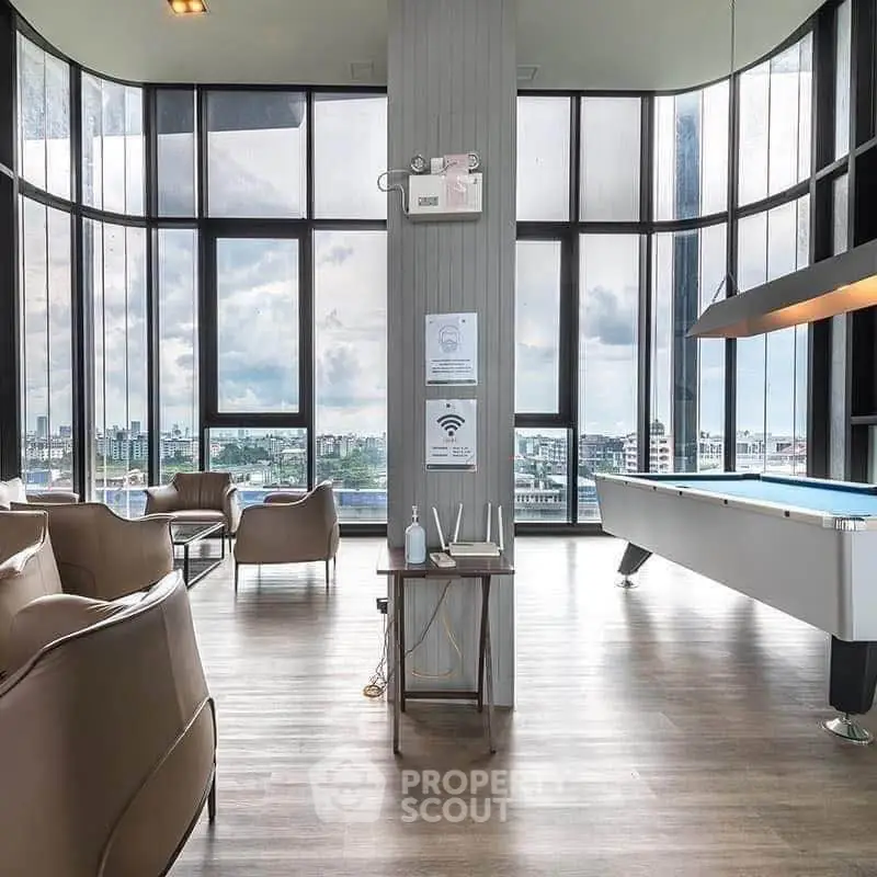 Luxurious high-rise lounge with panoramic city views and modern amenities.