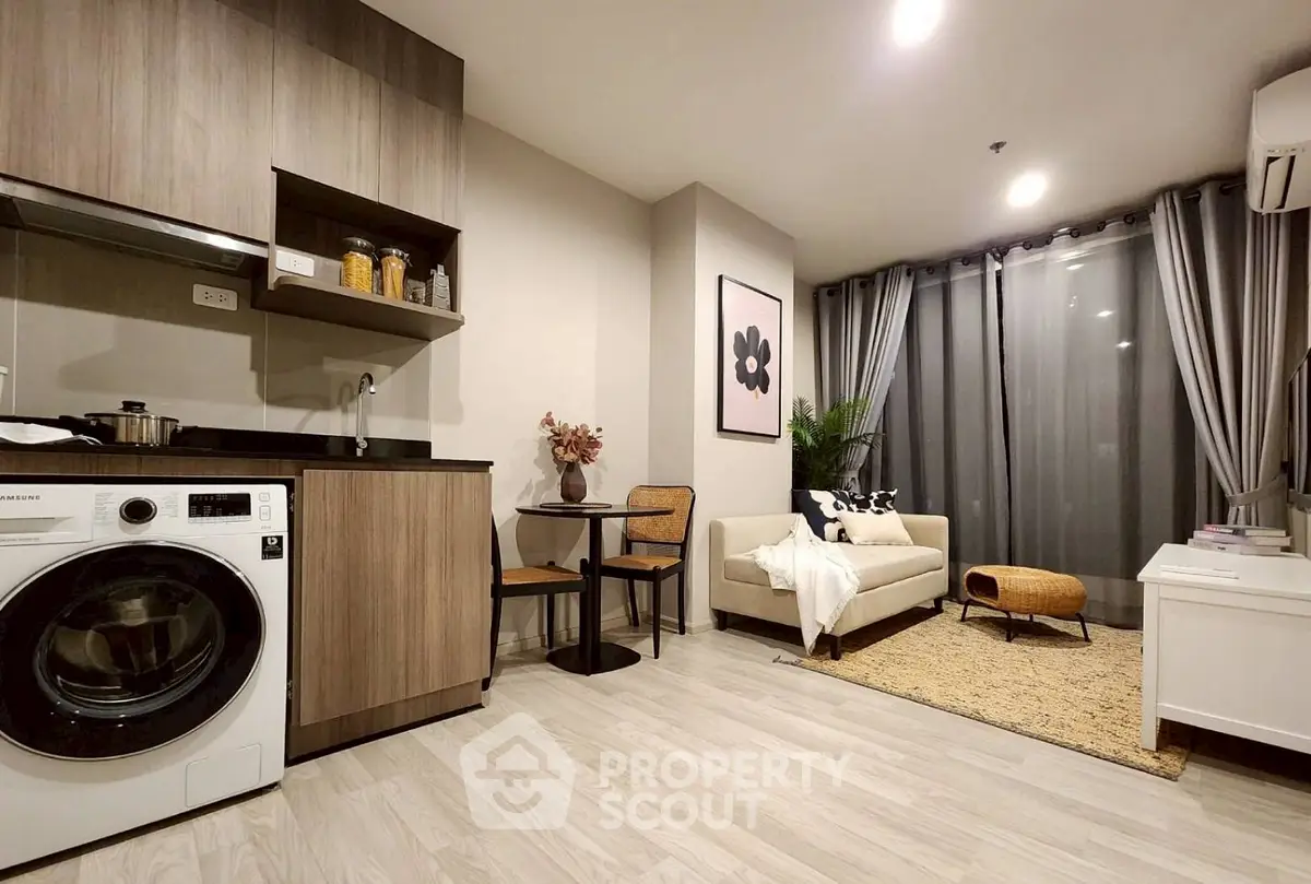Modern living room with washing machine and cozy seating area
