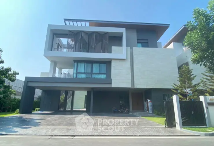 Modern luxury house exterior with sleek design and spacious driveway, surrounded by lush greenery.