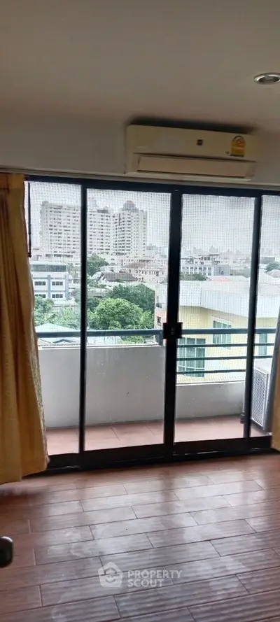 Spacious apartment with balcony offering stunning city views and modern amenities.