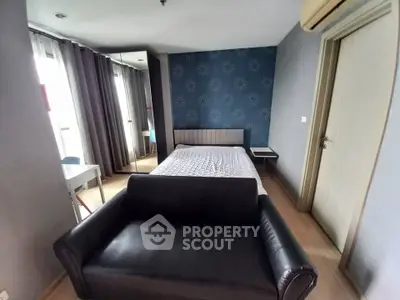 Modern bedroom with stylish decor and comfortable furnishings in a cozy apartment.