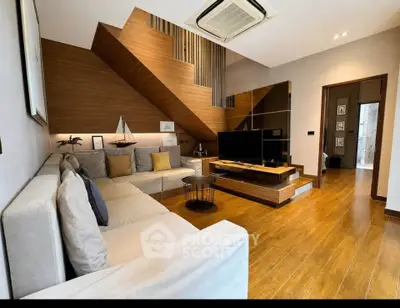 Modern living room with stylish wooden accents and cozy seating area
