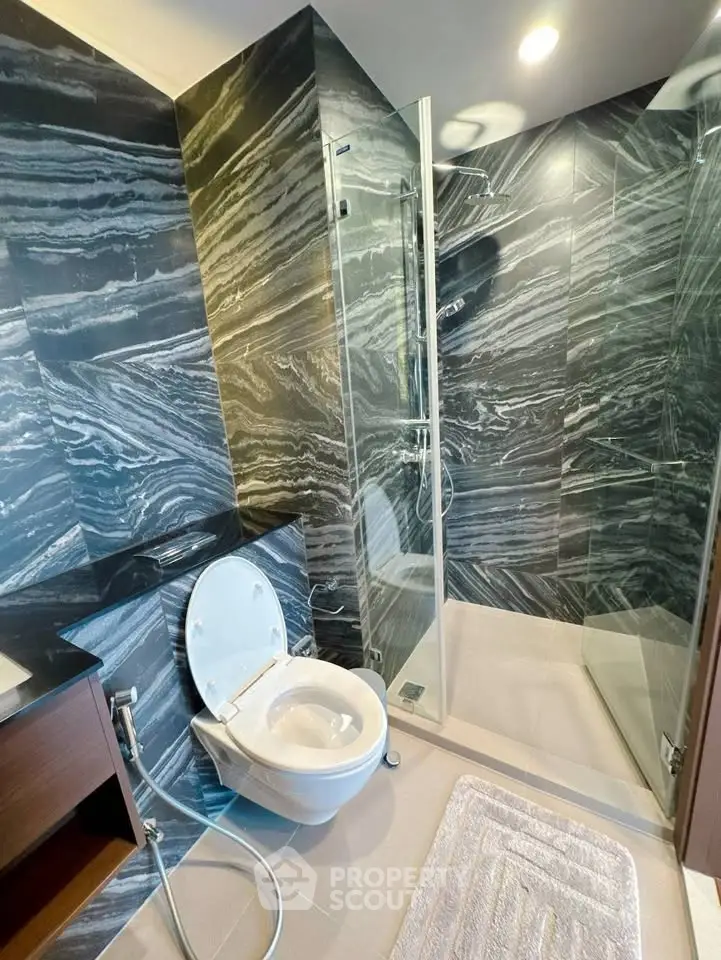 Luxurious bathroom with elegant marble walls and modern shower design