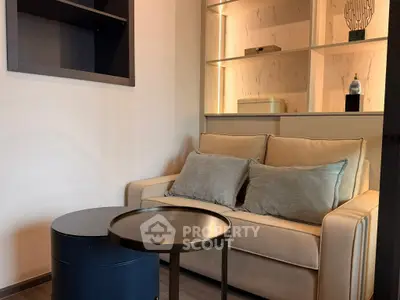 Cozy living room with modern sofa and stylish shelving, perfect for relaxation and entertaining.