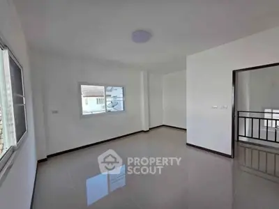 Spacious empty room with large windows and glossy tiled floor, perfect for customization.