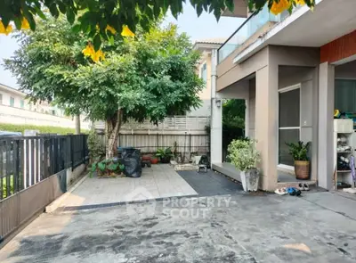 Charming residential exterior with spacious driveway and lush greenery, perfect for family living.