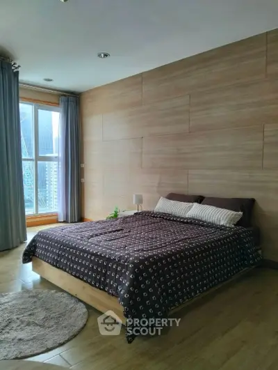 Modern bedroom with wooden accents and city view window