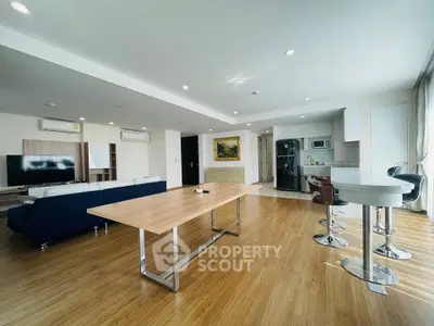 Spacious modern living room with open kitchen and stylish decor