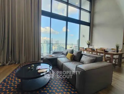 Luxurious living room with stunning city view and modern furnishings