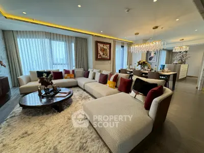 Luxurious living room with elegant decor and plush seating in a modern apartment.