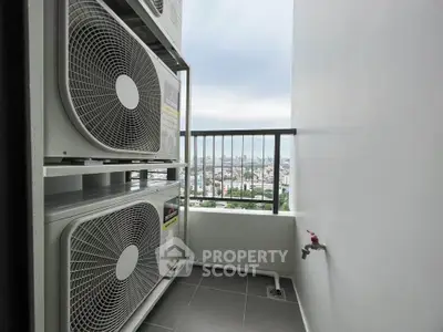 Modern apartment balcony with air conditioning units and city view