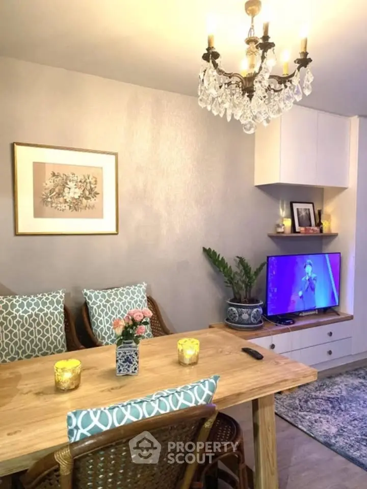 Charming living room with elegant chandelier and cozy decor