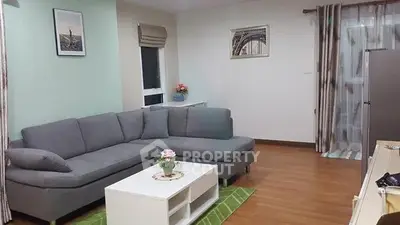 Modern living room with stylish gray sectional sofa and chic decor
