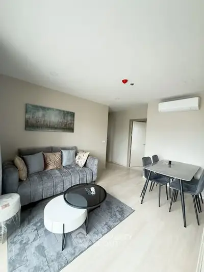 Modern living room with stylish furniture and elegant decor in a bright apartment.