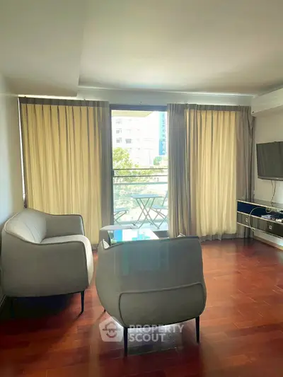 Modern living room with balcony view and stylish furniture