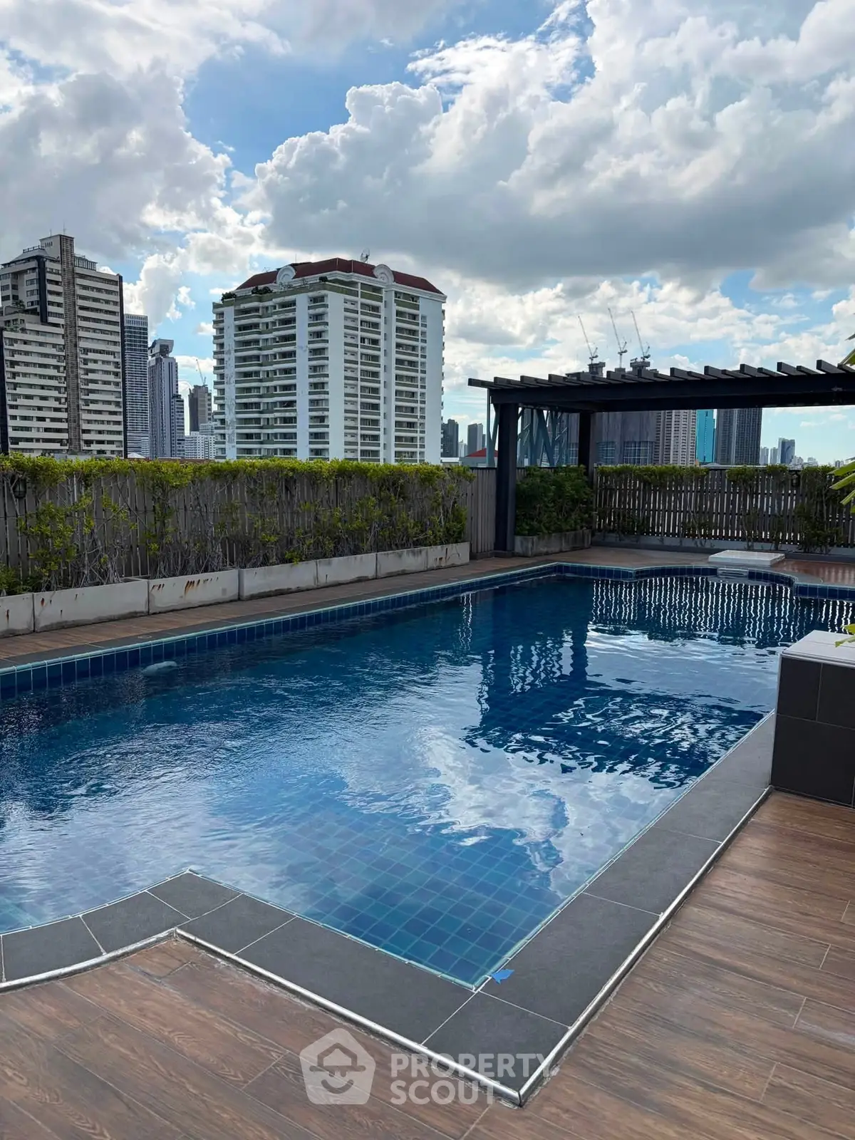 Luxurious rooftop pool with stunning city skyline views and modern design.