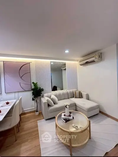 Stylish modern living room with cozy sectional sofa and elegant decor