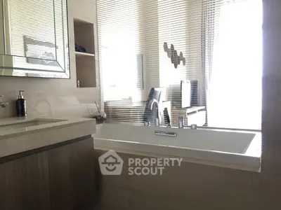 Modern bathroom with sleek bathtub and stylish decor