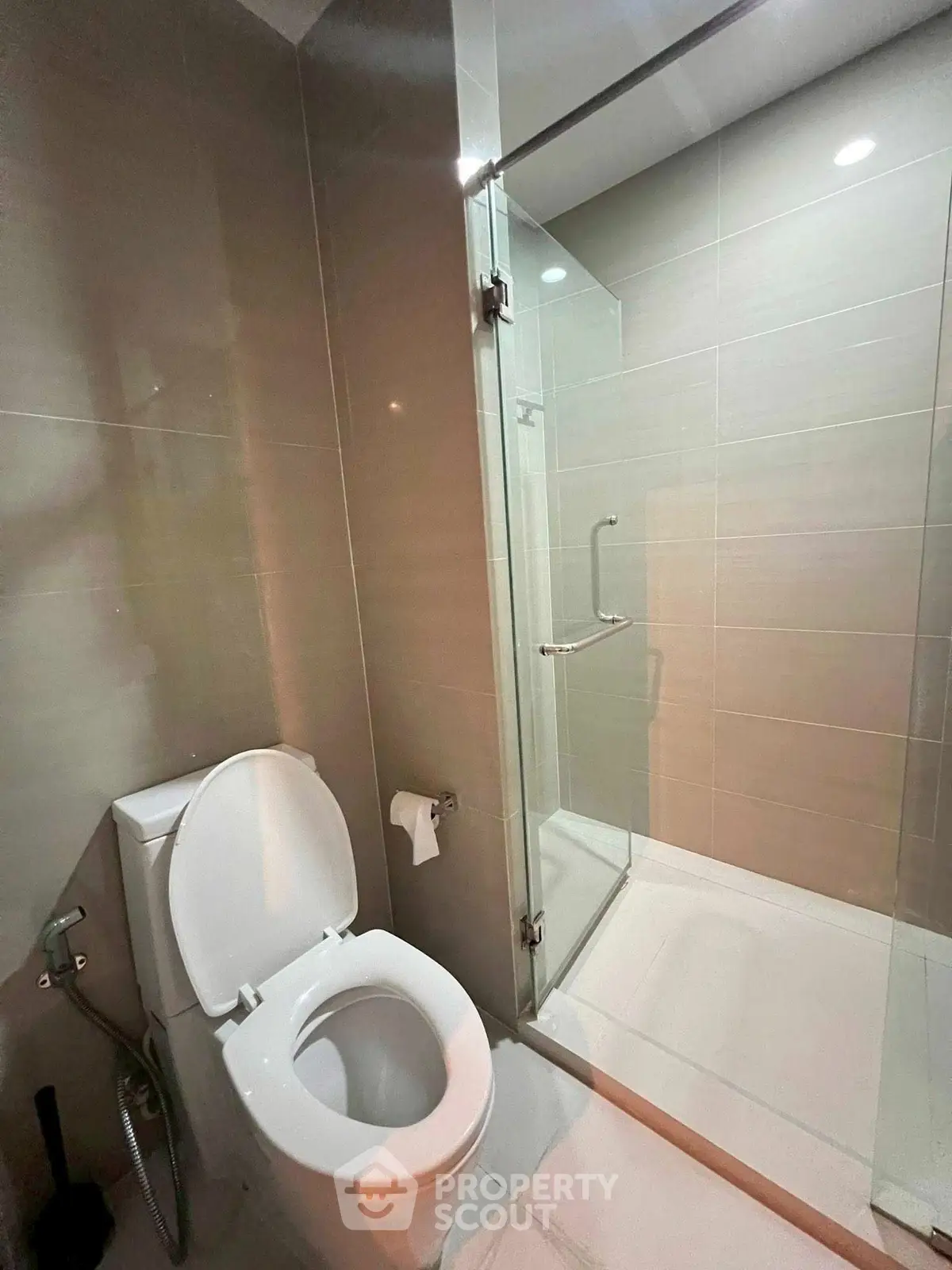 Modern bathroom with glass shower and sleek tile design