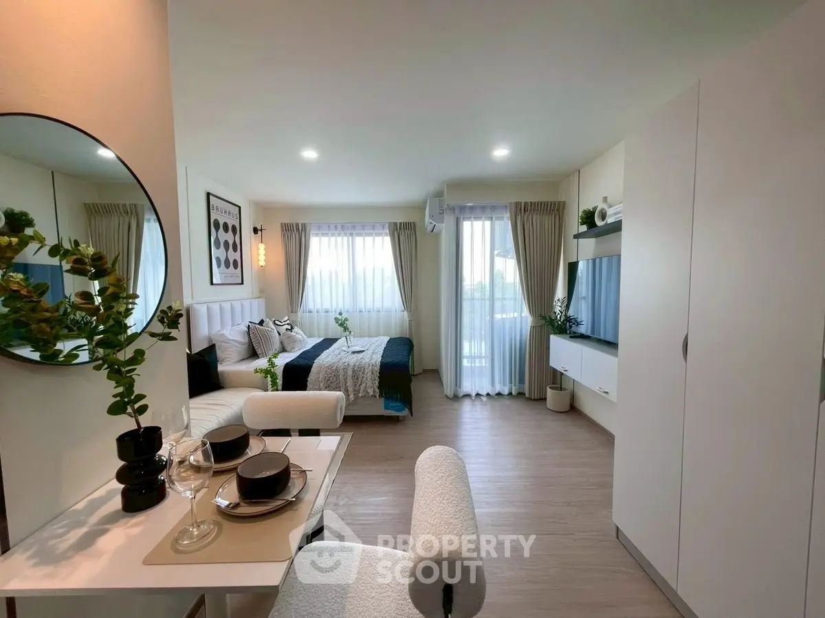 Modern studio apartment with stylish decor and natural light