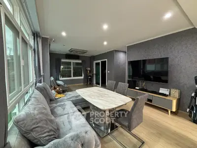 Spacious modern living room with elegant decor and large windows