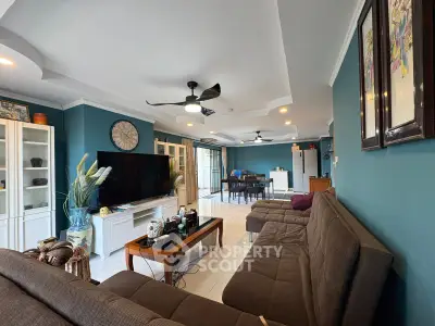Spacious living room with modern decor and open layout, featuring cozy seating and stylish furnishings.