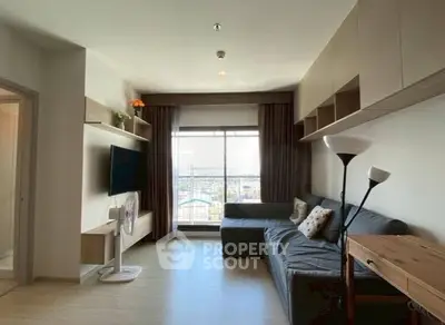 Spacious modern living room with large window and stylish furniture