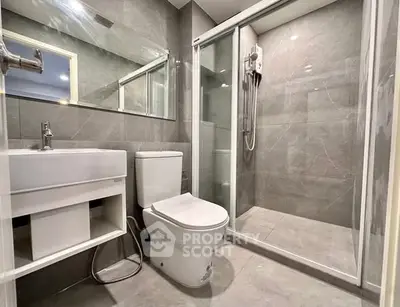 Modern bathroom with sleek design and glass shower enclosure