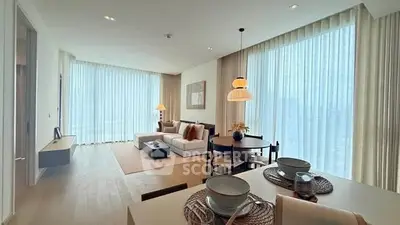 Spacious modern living room with elegant decor and large windows