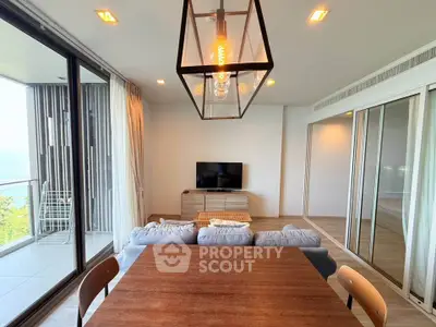 Modern living room with ocean view and stylish lighting