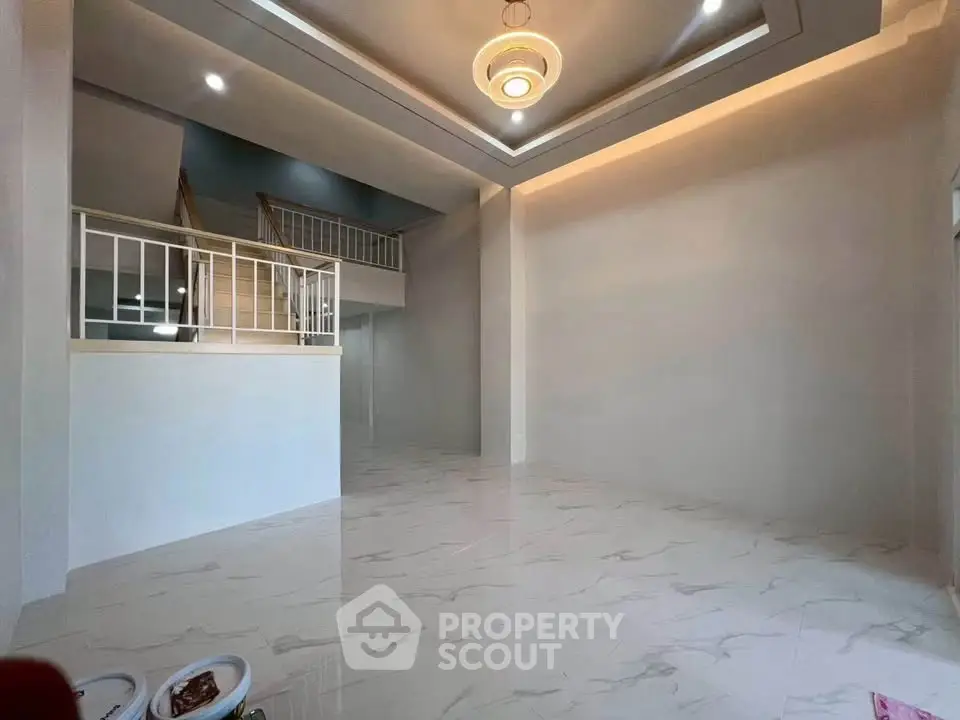 Spacious modern living room with elegant ceiling design and marble flooring