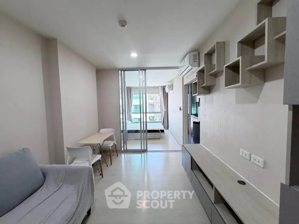 Modern living room with open layout and stylish furniture in a contemporary apartment.