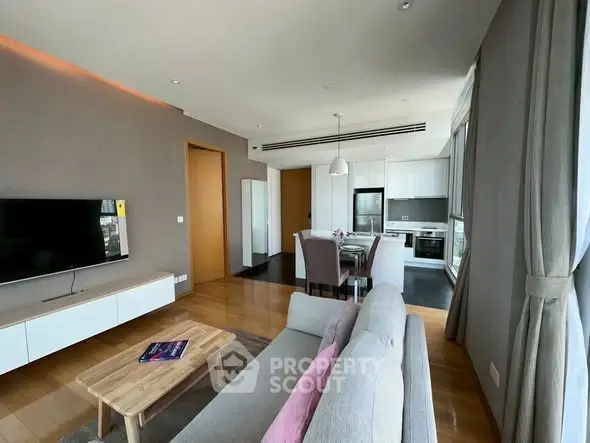 Spacious modern living room with open kitchen and stylish decor