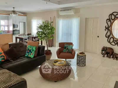 Spacious living room with modern decor and open kitchen layout