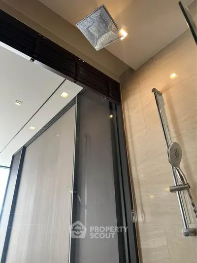 Luxurious modern bathroom with sleek shower design and elegant lighting