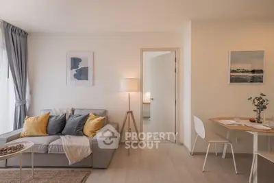 Modern living room with cozy sofa and dining area in stylish apartment