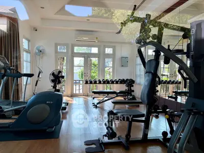 Spacious home gym with modern equipment and natural light