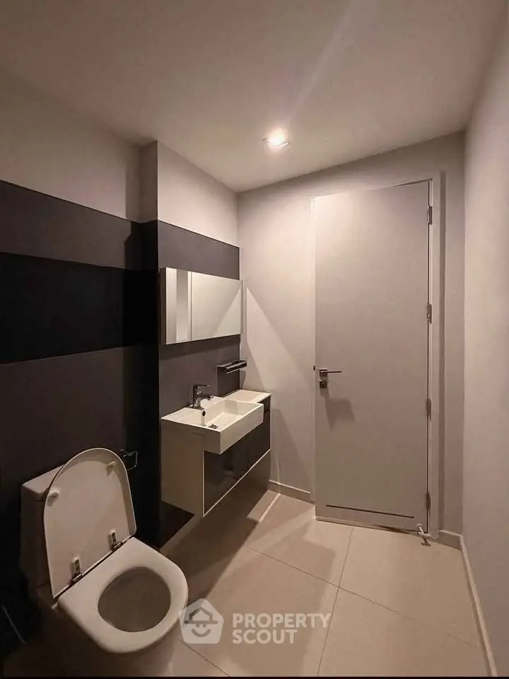 Modern minimalist bathroom with sleek fixtures and neutral tones