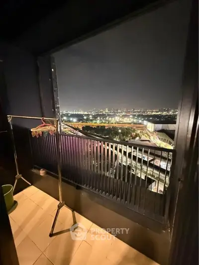 Stunning night cityscape view from a cozy balcony, perfect for relaxation.