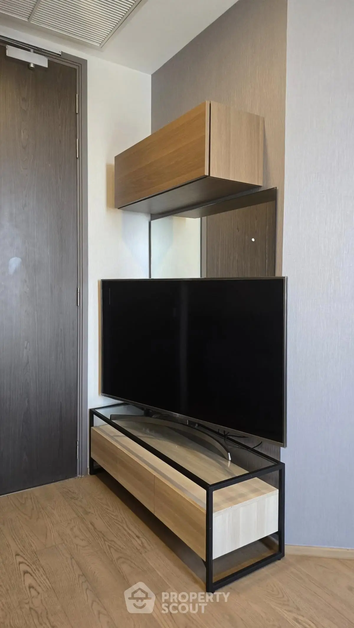 Modern living room with sleek TV stand and wooden accents