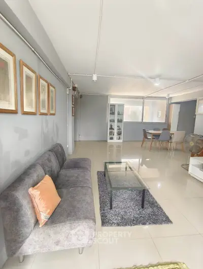Spacious modern living room with sleek decor and ample natural light