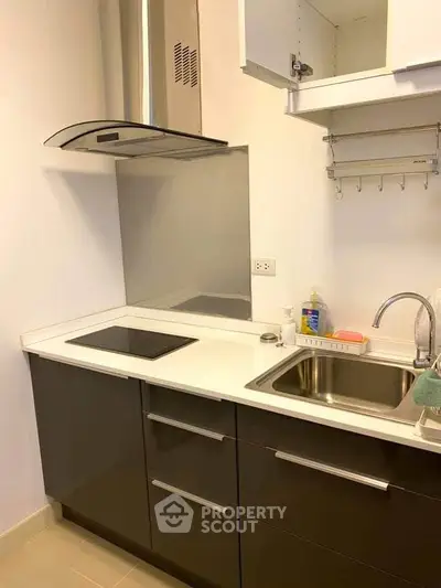 Modern kitchen with sleek cabinetry and electric cooktop