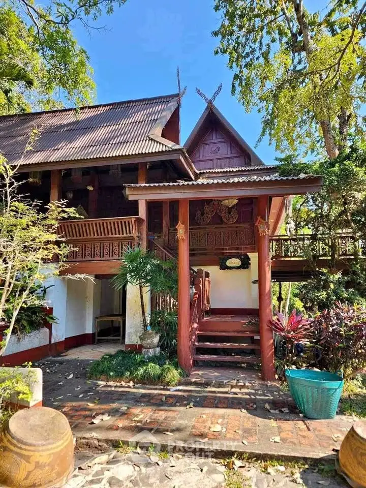 Charming traditional wooden house with lush garden and rustic architecture, perfect for serene living.