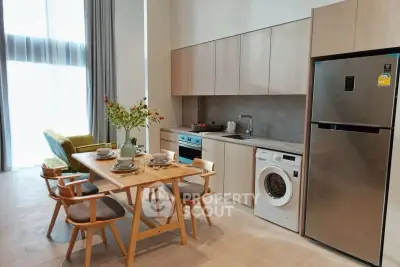 Modern open kitchen with dining area and appliances in a stylish apartment