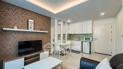 Modern living room with stylish decor and open kitchen layout