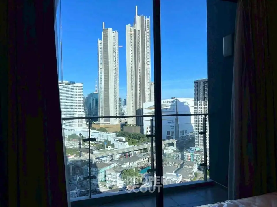 Stunning cityscape view from a high-rise apartment balcony with modern skyscrapers.
