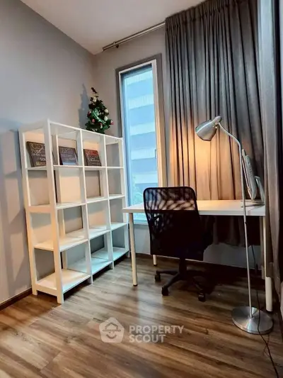 Modern study room with sleek desk, chair, and bookshelf, featuring floor-to-ceiling window and stylish decor.
