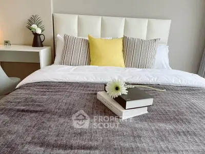 Elegant bedroom with plush bedding and stylish decor, perfect for a cozy retreat.