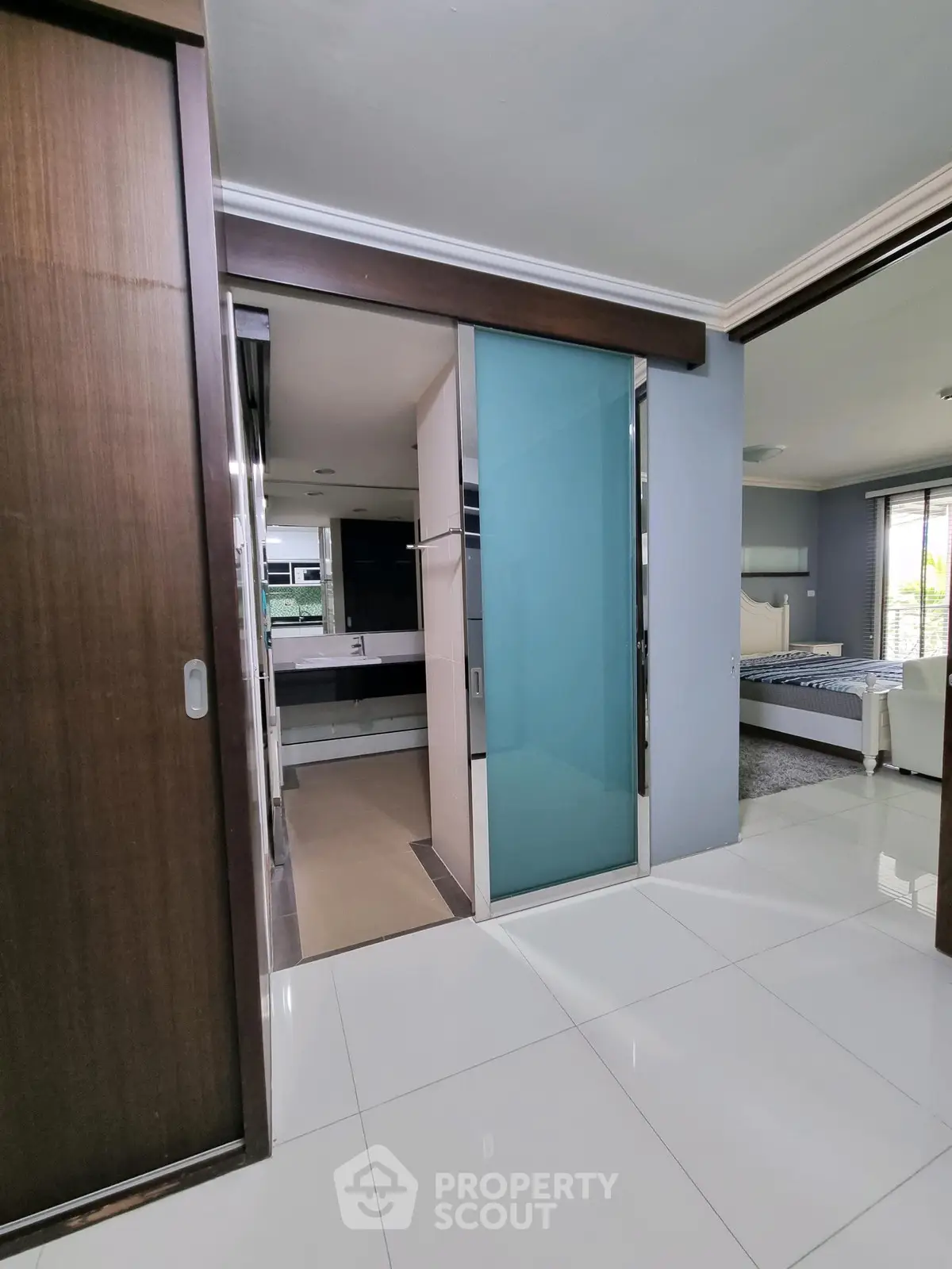 Modern interior with sleek bathroom and spacious bedroom in luxury apartment