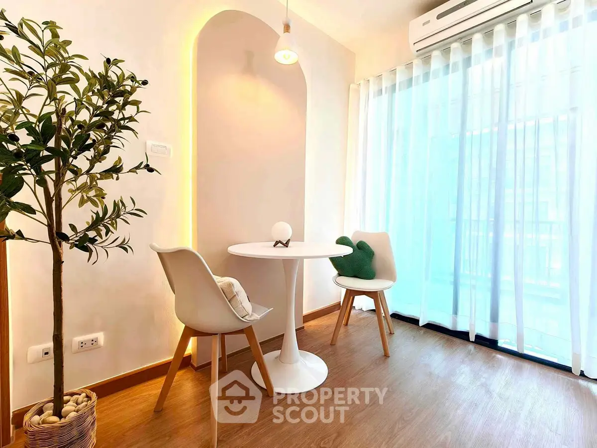 Charming small dining nook with modern decor and natural light